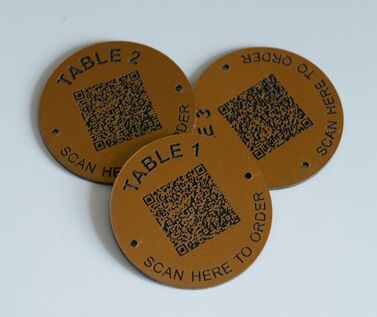 An image of Matte Brass Effect QR Code Table Numbers - 70mm